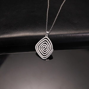 Minimalist stainless steel spiral cube pendant necklace on a sleek black background