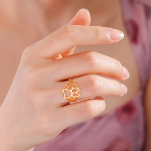Elegant gold hollow cat paw ring for women, minimalist pet jewelry on finger