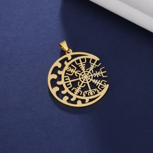 Macro shot of 18K gold crescent moon pendant with a Viking compass cutout design