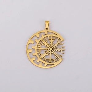 Macro detail of gold plated Viking compass pendant with crescent moon hollow design