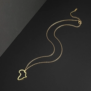Minimalist gold hollow Africa map pendant necklace with adjustable chain on dual-tone background