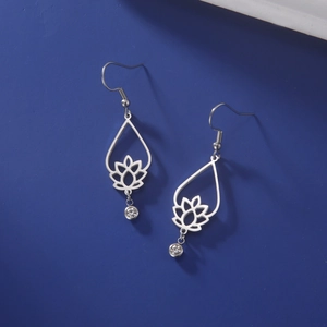 Silver stainless steel lotus drop earrings with crystal on deep blue backdrop