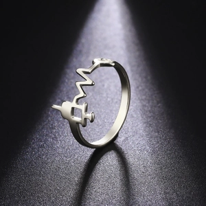 Minimalist stainless steel syringe heart rate ring with 18K gold plating on black base