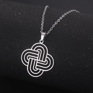 Polished silver stainless steel Celtic knot pendant necklace on a black background