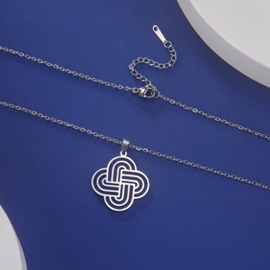Close-up of stainless steel Celtic knot pendant with lobster clasp and extension chain