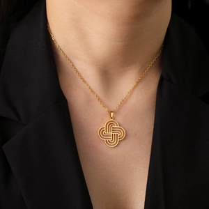 Golden Celtic knot pendant necklace in stainless steel shown on a model neck