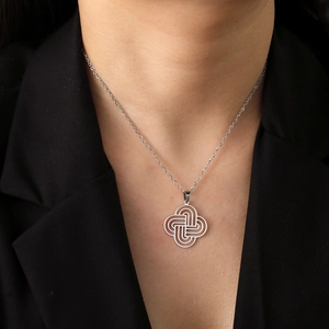 Elegant cutout Celtic cross pendant necklace in silver stainless steel on a model