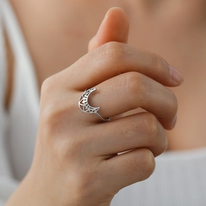 Vintage stainless steel crescent moon ring with hollow lotus pattern for women