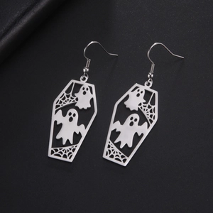 Detailed close-up of silver ghost and spider web patterns inside coffin-shaped earrings