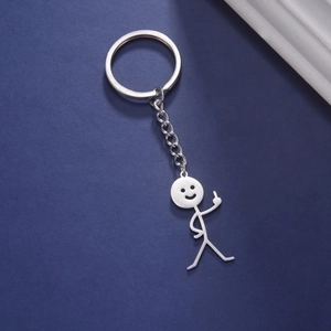 Close-up of a silver stainless steel stickman keychain with a hollow smiley face