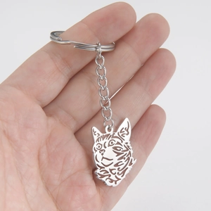 Cute hollow-out cat head keychain with silver metal keyring and durable O-link chain