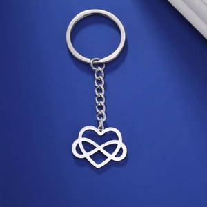 Close-up of silver infinity heart keychain with modern interlocking metal pendant design