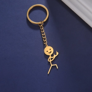 Detail of creative gold cartoon stickman keychain with funny middle finger pose