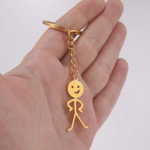 Goldener Titanstahl Schlüsselanhänger mit witzigem Strichmännchen und Smiley-Anhänger
