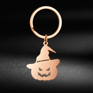 Rose gold pumpkin with wizard hat keychain charm for Halloween, polished metal finish