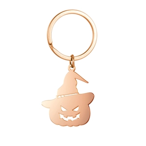 Detail of rose gold pumpkin witch hat keychain with hollow-out metal design