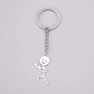 Close-up of polished silver keychain with funny stick figure flipping the middle finger