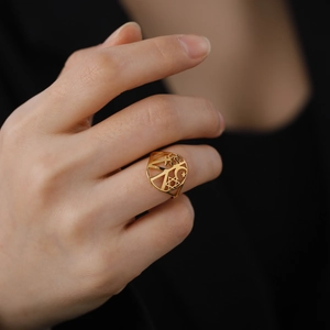 Gold stainless steel ring featuring celestial moon star and religious peace symbols