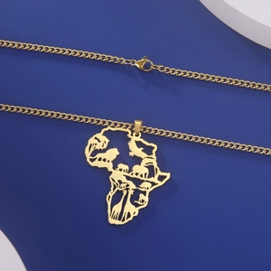 Detail of gold Africa map pendant with hollowed giraffe, lion and elephant patterns