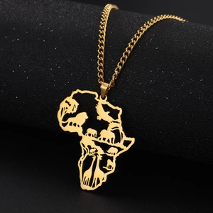 Detail of gold Africa map pendant featuring hollow-out lion and elephant animal silhouettes