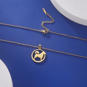 Detailed view of dog pendant necklace with adjustable chain and gold lobster clasp