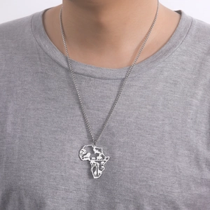 Detail shot of Africa map pendant with animal cutouts on a stainless steel chain