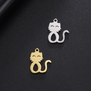 Minimalist cutout cat pendant in gold and silver finish on black leather background