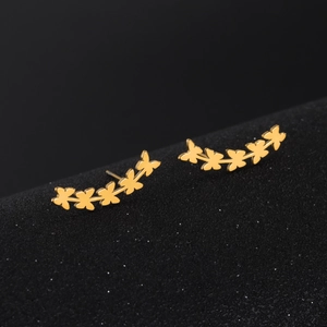 Elegant gold butterfly ear crawler earrings with five hollow butterfly charms on a black base