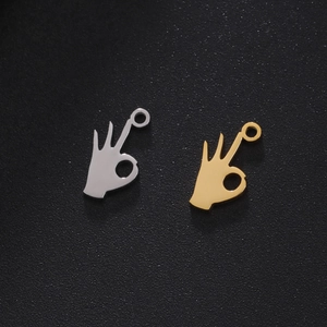 Polished stainless steel OK hand gesture pendants in gold and silver finishes