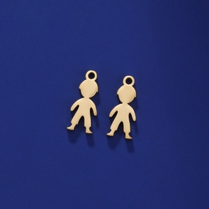 Close-up of golden stainless steel boy pendants with polished finish and jump rings