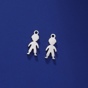 Macro detail of polished stainless steel boy and girl silhouette pendants for DIY jewelry