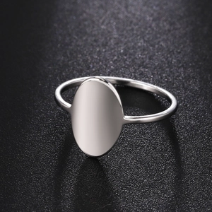 Polished silver stainless steel oval signet ring for women shown from a 45-degree angle