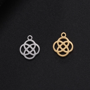 Detailed view of Celtic knot charms in gold and silver finish for DIY jewelry