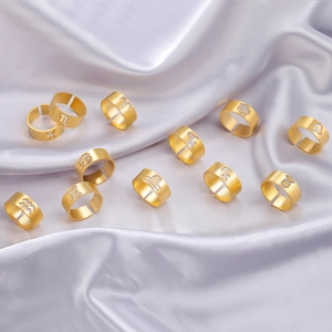 Set of 12 adjustable gold stainless steel zodiac rings featuring hollowed-out star signs