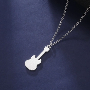 Silver electric guitar pendant necklace with metallic texture on dark blue background