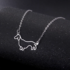 Minimalist silver dachshund outline pendant necklace on a sleek stainless steel chain