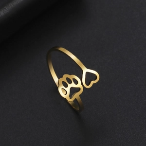 Detail of 18K gold plated open ring with hollow heart and paw print design