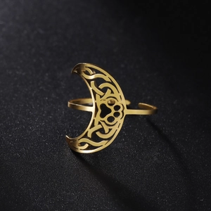 Detail of adjustable gold stainless steel ring with hollow moon and paw print patterns