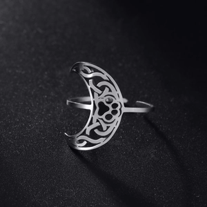 Adjustable stainless steel ring featuring hollow crescent moon and celtic paw print designs