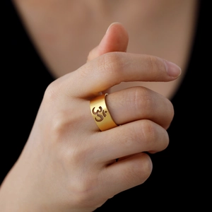 Golden matte stainless steel Om symbol ring with hollow yoga sign design for women
