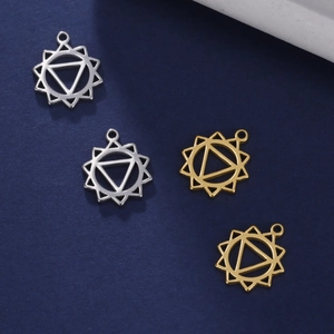 Detail showing geometric hollow star and triangle pendants in gold and silver finish