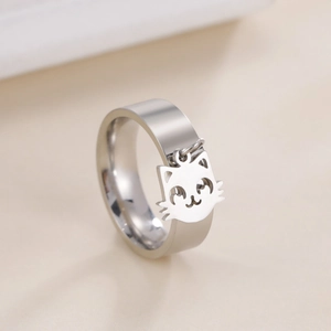 Detailed close-up of a silver stainless steel ring featuring a cute cat face pendant