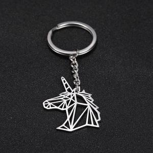 Macro view of geometric cutout unicorn keychain with sleek stainless steel lines