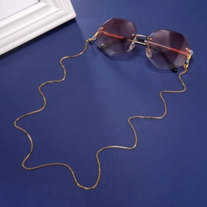 Close-up of golden eyeglass chain with silicone loops on rimless gradient purple sunglasses