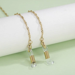 Macro detail of gold water-ripple eyeglass chain with adjustable silicone loops