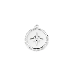 Detail of silver round pendant featuring embossed star motif and beaded border texture