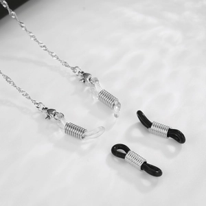 Macro detail of silver eyeglass chain with lobster clasps and non-slip silicone loops