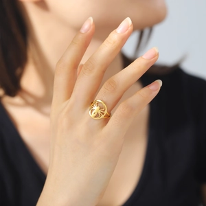 Golden cutout spider ring in stainless steel for men and women on finger