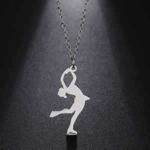 Polished stainless steel gymnast pendant necklace on a textured black backdrop