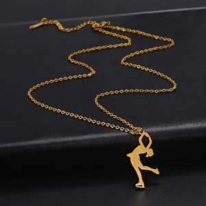 Detailed view of a gold-plated stainless steel figure skater silhouette pendant on a chain